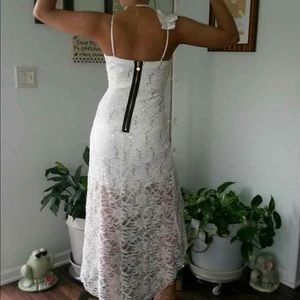 White high low dress with a lace overlay.